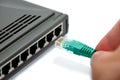 Router and green network cable Royalty Free Stock Photo