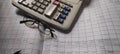 Financial  Analysis table with calculator and glasses. Royalty Free Stock Photo