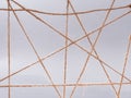 Routine network spider web of coarse threads on gray background Royalty Free Stock Photo