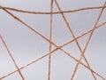 Routine network spider web of coarse threads on gray background Royalty Free Stock Photo