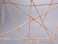 Routine network spider web of coarse threads on gray background Royalty Free Stock Photo