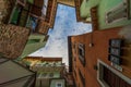 Rovereto street blue sky in small historic medieval town looking up