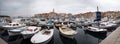 Rovinj, Croatia - August 31, 2007: Motorboats, boats and yachts on water in port of Rovinj. Medieval vintage houses of old town on