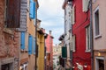 Rovinj, Croatia; 7/18/2019: Picturesque narrow street with colorful facades of the houses