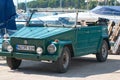 Rovinj, Croatia - September 1, 2007: Beautiful vintage Volkswagen 181 Thing car on the pier with yahts and boats in the
