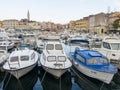 Boats anchered in Rovinj Marina and the Old Town with Basilica of St. Euphemia at the top 0907