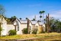 Row Of Abandoned Buildings With Metal Roofs