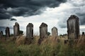 a row of aged gravestones under a cloudy sky Royalty Free Stock Photo