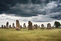 a row of aged gravestones under a cloudy sky Royalty Free Stock Photo