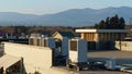 A row of air conditioning units on a rooftop. Royalty Free Stock Photo