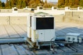 A row of air conditioning units on a rooftop. Royalty Free Stock Photo