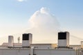 A row of air conditioning units on a rooftop. Royalty Free Stock Photo