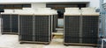 Row of air conditioning units on rooftop Royalty Free Stock Photo