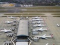 A row of aircraft outside a terminal at London Heathrow airport Royalty Free Stock Photo