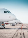 A row of airplanes parked in airport. Royalty Free Stock Photo