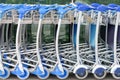 Row of airport luggage trolleys Royalty Free Stock Photo