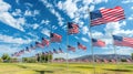 Row of American flags waving against a blue sky with clouds Royalty Free Stock Photo