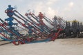 Row of American Oil Wells with zipper frac equipment