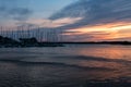 Small boat harbor with sailing boats in pink evening sunlight Royalty Free Stock Photo