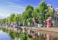 Row of ancient renovated mansions near a canal, Amsterdam, Netherlands
