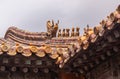 Row of animal sculptures on ridge of roof in Forbidden City, Beijing, China