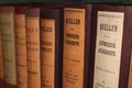 Row of antique books with leather covers and German titles in black letters