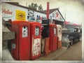 A Row of Antique Gasoline Pumps with Classic 1930`s Ford. Royalty Free Stock Photo