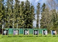 Row of archery targets on a field with forest in the background. Royalty Free Stock Photo