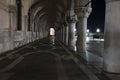 Row of arches underneath the Doge`s Palace in Piazza San Marco in Venice. Archway medieval columns in Venice Royalty Free Stock Photo