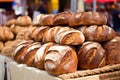 a row of artisanal loaves of bread at a food market Royalty Free Stock Photo