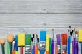 Row of artist paint brushes on old wooden background Royalty Free Stock Photo