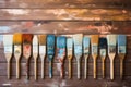 Row of artist paintbrushes closeup on artistic canvas Royalty Free Stock Photo