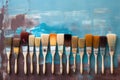 Row of artist paintbrushes closeup on artistic canvas Royalty Free Stock Photo