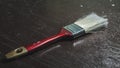 Row of artist paintbrushes closeup on old wooden rustic table