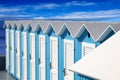 Row of attractive blue and white beach huts