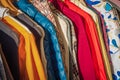 Row of autumn coats hanging on rack, shopping. Cloth shop, clothing store, female and male collection in a outfit store Royalty Free Stock Photo