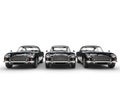 Row of awesome black vintage cars