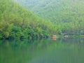 A row awnings in the middle of lake and mountains