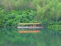 A row awnings near mountains and lake Royalty Free Stock Photo