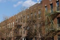 Row of Generic Old Brick Apartment Buildings with Fire Escapes in Astoria Queens of New York City Royalty Free Stock Photo