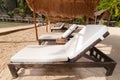 A row of beach beds at the shore Royalty Free Stock Photo