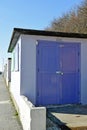 A row of beach huts with a blue sky background Royalty Free Stock Photo