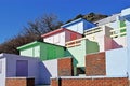 A row of beach huts with a blue sky background Royalty Free Stock Photo