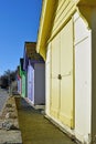 A row of beach huts with a blue sky background Royalty Free Stock Photo