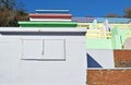 A row of beach huts with a blue sky background Royalty Free Stock Photo