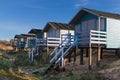 Row of beach huts at Old Hunstaton. Royalty Free Stock Photo