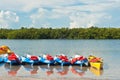 Row of beached kayaks waiting to be rented