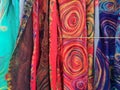 Row of beautiful colorful handmade scarves from felted wool closeup