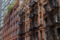 Row of Beautiful Old Brick Apartment Buildings with Fire Escapes on the Lower East Side of New York City Royalty Free Stock Photo