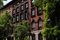 Row of Beautiful Old Brick Residential Buildings with Green Trees in the East Village of New York City Royalty Free Stock Photo